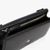 Clutch met monogram en klep in korrelleer Clutch met monogram en klep in korrelleer