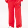 Jongens-joggingbroek met golvend vlaglogo Jongens-joggingbroek met golvend vlaglogo
