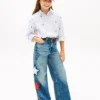 Kinderjeans met hoge taille en wijde pijpen met sterrenmotief Kinderjeans met hoge taille en wijde pijpen met sterrenmotief