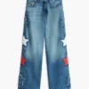 Kinderjeans met hoge taille en wijde pijpen met sterrenmotief Kinderjeans met hoge taille en wijde pijpen met sterrenmotief