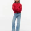Kinderjeans met uitlopende pijpen en opgestikte zakken Kinderjeans met uitlopende pijpen en opgestikte zakken