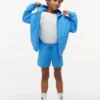 Korte broek met vlaglogo in dezelfde kleur voor kinderen Korte broek met vlaglogo in dezelfde kleur voor kinderen