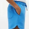 Korte broek met vlaglogo in dezelfde kleur voor kinderen Korte broek met vlaglogo in dezelfde kleur voor kinderen