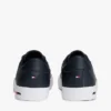 Sneaker van gevulkaniseerd leer met vlaggenstreep Sneaker van gevulkaniseerd leer met vlaggenstreep