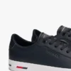 Sneaker van gevulkaniseerd leer met vlaggenstreep Sneaker van gevulkaniseerd leer met vlaggenstreep
