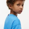 T-shirt met vlaglogo in dezelfde kleur voor kinderen T-shirt met vlaglogo in dezelfde kleur voor kinderen
