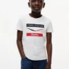 Tommy x Cadillac F1® Team Chevron T-shirt voor kinderen Tommy x Cadillac F1® Team Chevron T-shirt voor kinderen