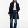 Trenchcoat met dubbele rij knopen en ceintuur Trenchcoat met dubbele rij knopen en ceintuur